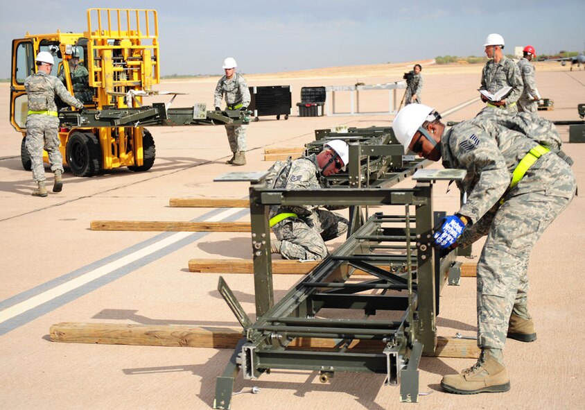 Airmen from the 7th Maintenance Group compete in the Global Strike Challenge, Sept. 27, 2011 at Dyess Air Force Base, Texas. The Global Strike Challenge pits units' top security forces, maintainers, and missile and bomber crews in head-to-head competition to be recognized as the best of the best. (U.S Air Force photo by Senior Airman Chelsea Browning/ Released)