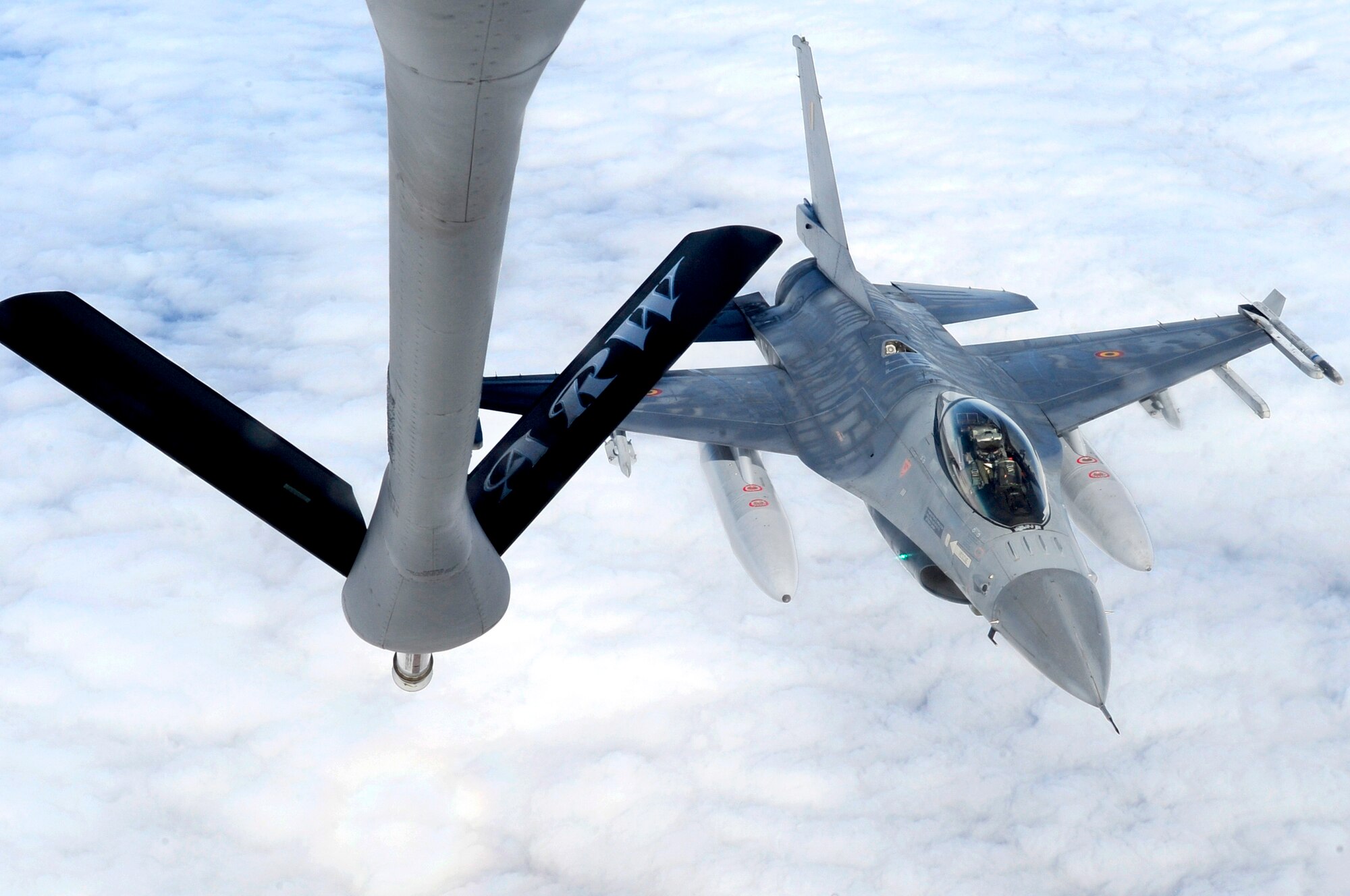 RAF MILDENHALL, England – A Belgian F-16 Fighting Falcon, moves into place over Germany, to receive fuel from a 100th Air Refueling Wing KC-135 Stratotanker during Exercise Brilliant Arrow, Sept. 21, 2011. The exercise gave participating nations an opportunity to work and train together in preparation for NATO Response Force 2012. (U.S. Air Force photo/Senior Airman Ethan Morgan)