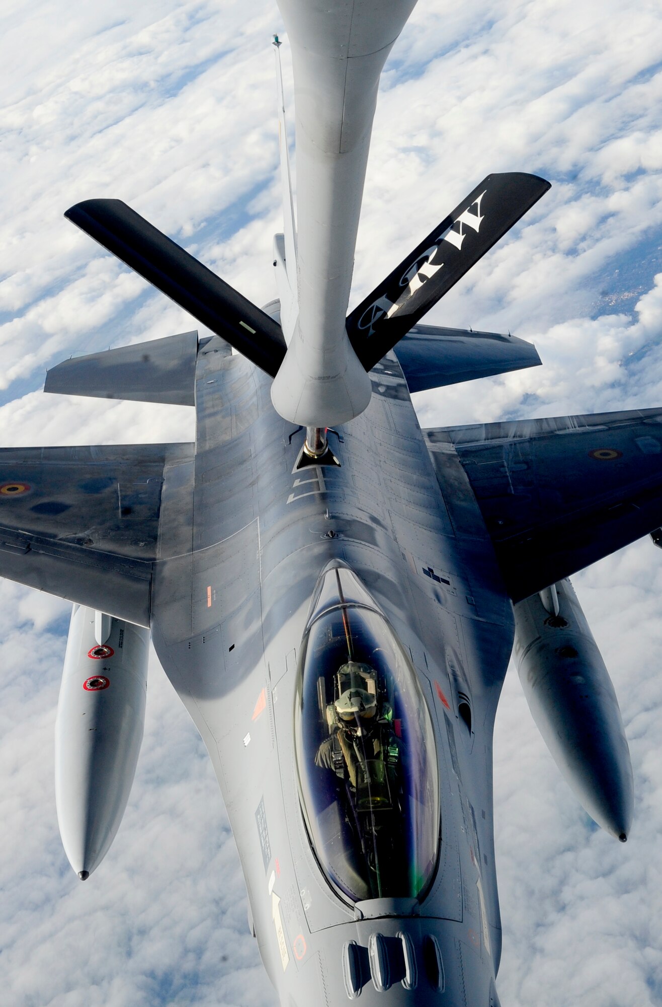 RAF MILDENHALL, England – A 100th Air Refueling Wing KC-135 Stratotanker refuels a Belgian F-16 Fighting Falcon in the skies over Germany during Exercise Brilliant Arrow, Sept. 21, 2011. The F-16 was one of 28 fighter aircraft participating in the multinational air exercise conducted by NATO. (U.S. Air Force photo/Senior Airman Ethan Morgan)