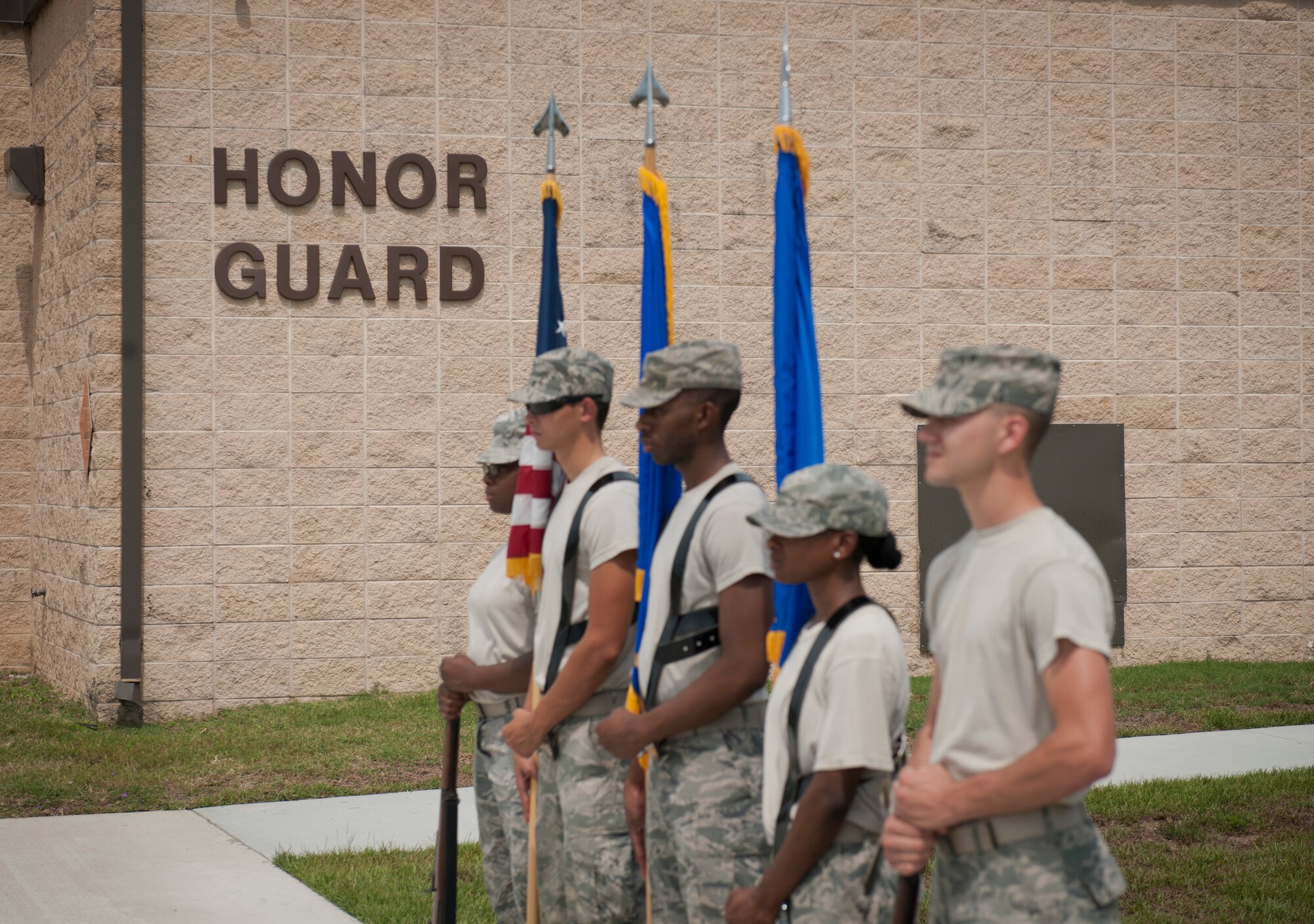 Moody Honor Guard members stand at parade rest and await their evaluations during Honor Guard training at Moody AFB, Ga., Sept. 21, 2011. Moody Honor Guard members were being trained by Air Force Honor Guard members who train 15-18 bases around the Air Force annually. (U.S. Air Force photo by Airman 1st Class Joshua Green/Released)

