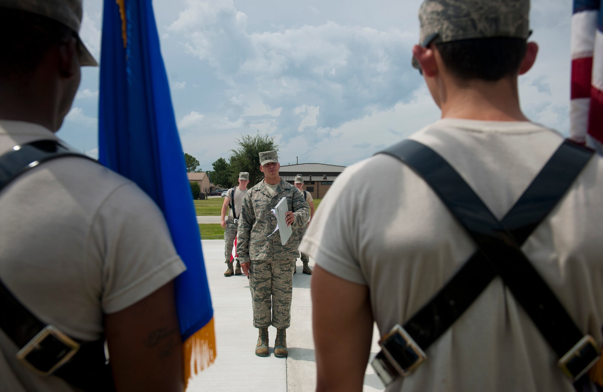 U.S. Air Force Senior Airman Justin Baker, USAF Honor Guard core supervisor, from Bolling Air Force Base, Washington D.C., corrects Moody Airmen on mistakes they’ve made during Honor Guard training at Moody AFB, Ga., Sept. 21, 2011. Baker explained their mistake and showed them the proper way to perform the move.  (U.S. Air Force photo by Airman 1st Class Joshua Green/Released)
