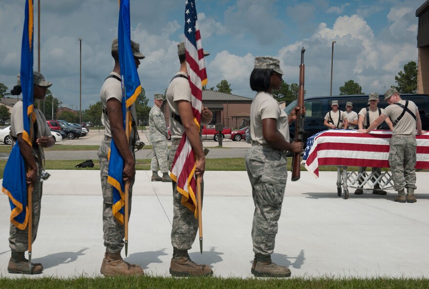 U.S. Air Force Senior Airman Leonard Brower, USAF Honor Guard member, from Bolling Air Force Base, Washington D.C., observes Moody Airmen from a distance ensuring proper techniques are being performed during Honor Guard training at Moody AFB, Ga., Sept. 21, 2011. During their training, Airmen were taught proper techniques and given evaluations to show their ability to perform techniques. (U.S. Air Force photo by Airman 1st Class Joshua Green/Released)
