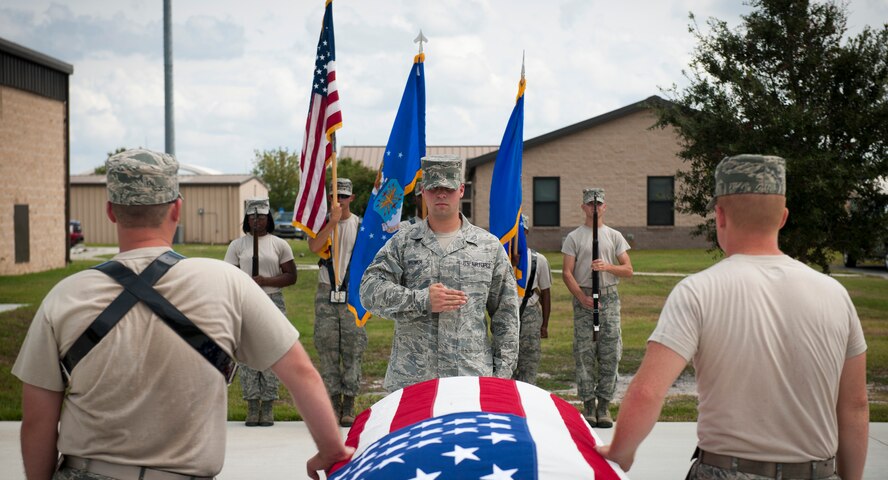 U.S. Air Force Senior Airman Leonard Brower, USAF Honor Guard member, from Bolling Air Force Base, Washington D.C., renders a slow salute to a mock casket during Honor Guard training at Moody AFB, Ga., Sept. 21, 2011. Airmen from the USAF Honor Guard came to Moody to teach Airmen proper honor guard techniques. (U.S. Air Force photo by Airman 1st Class Joshua Green/Released)