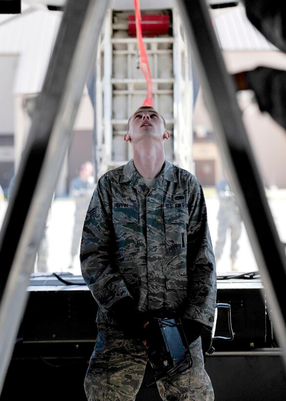 Senior Airman Andrew Peppin, 28th Aircraft Maintenance Squadron weapons journeyman, uses a portable control unit to raise Joint Air-to-Surface Stand-off Missiles on a B-1B Lancer during the Global Strike Challenge on Ellsworth Air Force Base, Sept. 21, 2011. The goals of the competition include recognizing superior performers, enhancing esprit de corps while strengthening teamwork and improving readiness and combat capabilities through preparation, innovation, competition and teamwork. (U.S. Air Force photo by Tech. Sgt. Jerry Fleshman/Released)