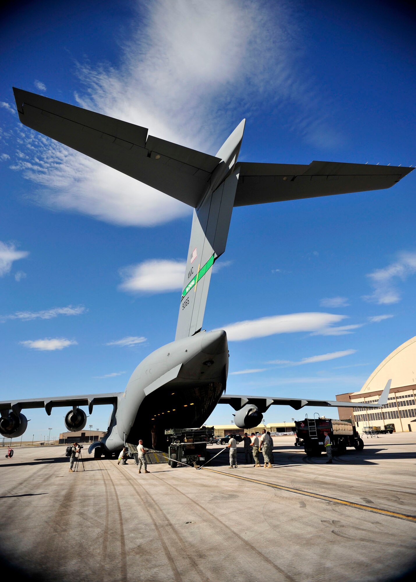 A C-17 Globemaster III from McChord Air Force Base, Wash, is loaded with equipment by Airmen from the 28th Logistics Readiness and Civil Engineer Squadrons, during flightline operations on Ellsworth Air Force Base, S.D. Sept., 23, 2011. The cargo was used to support ongoing operations in Southwest Asia. (U.S. Air Force photo by Tech. Sgt. Jerry Fleshman/Released)
