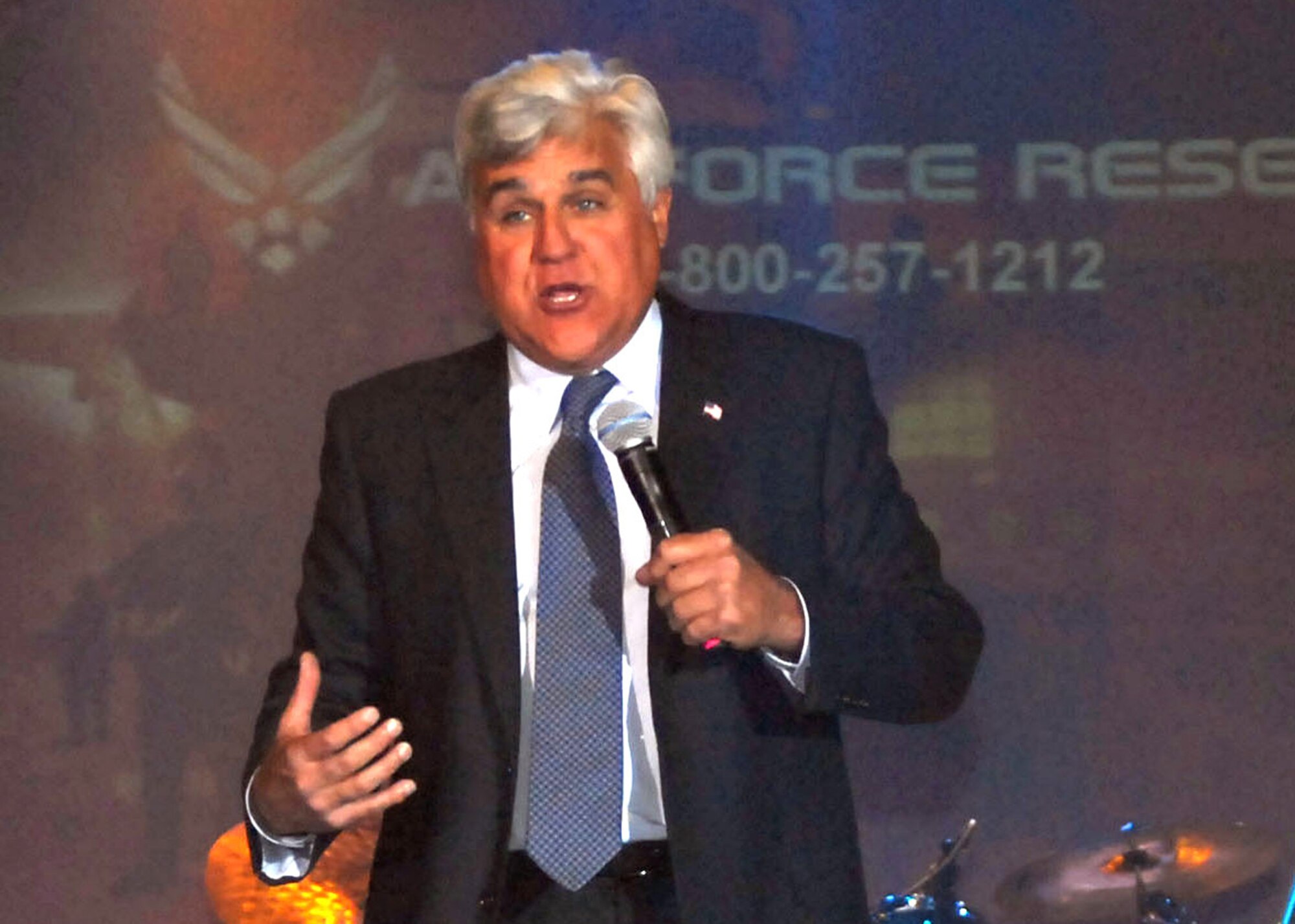 Comedian and late-night talk show host Jay Leno tore the house down during his performance for the troops in Hangar 4 at McChord Field, Wash., May 7. This was one of Leno's many stops during his Tour for the Troops sponsored by Air Force Reserve Recruiting Service. (U.S. Army photo by Spc. Jarrett Branch/Released)
