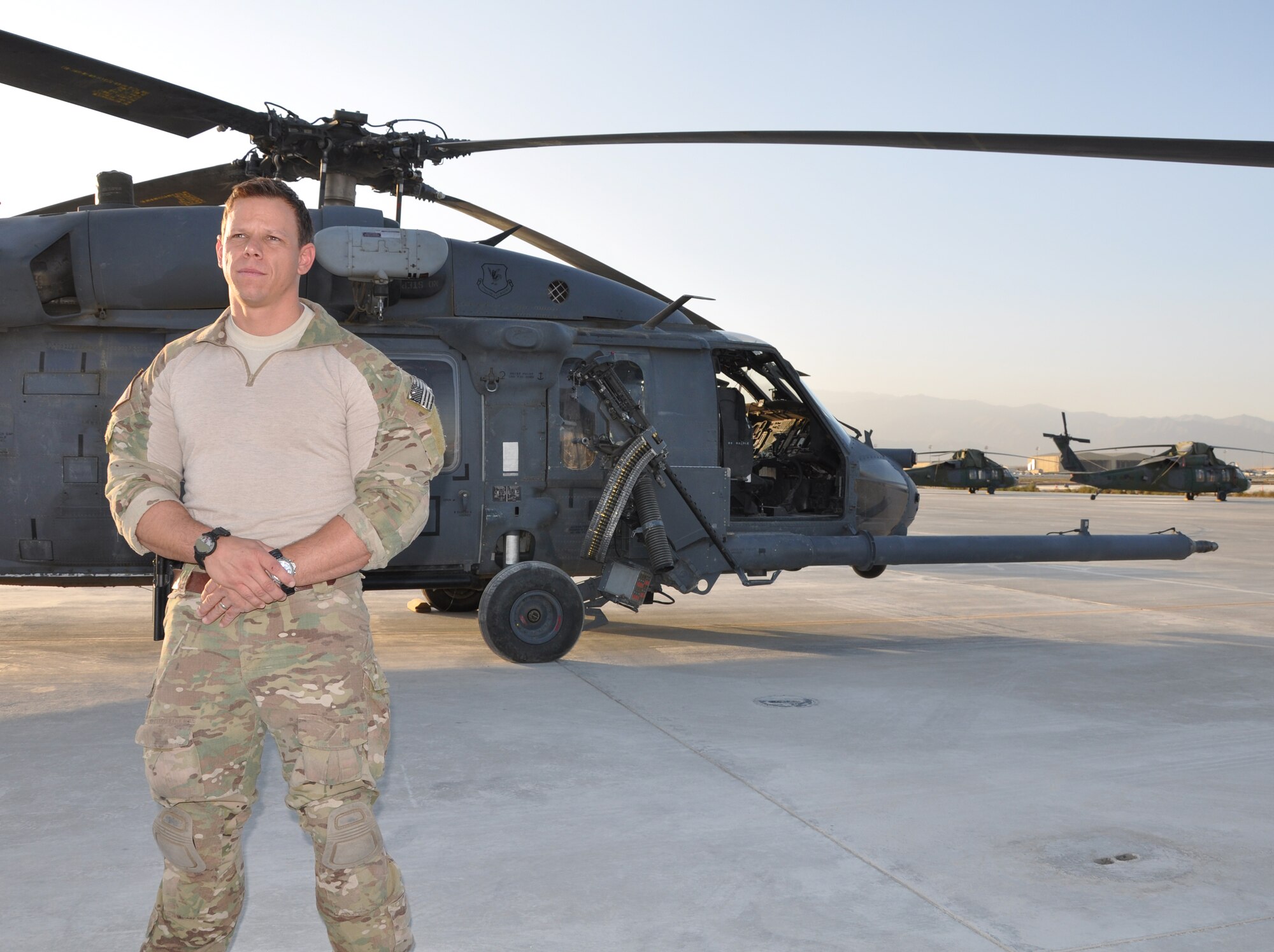 BAGRAM AIRFIELD, Afghanistan -- Tech. Sgt. Kristopher Burridge 83rd Expeditionary Rescue Squadron pararescue team leader, poses next to an HH-60G Pave Hawk here Sept. 26, 2011. Burridge helped complete a high-risk rescue of two wounded Afghan National Army personnel during a dynamic mission Sept. 11, 2011. Burridge is from Clearwater Beach, Fla. (U.S. Air Force photo/Staff Sgt. John Wright)