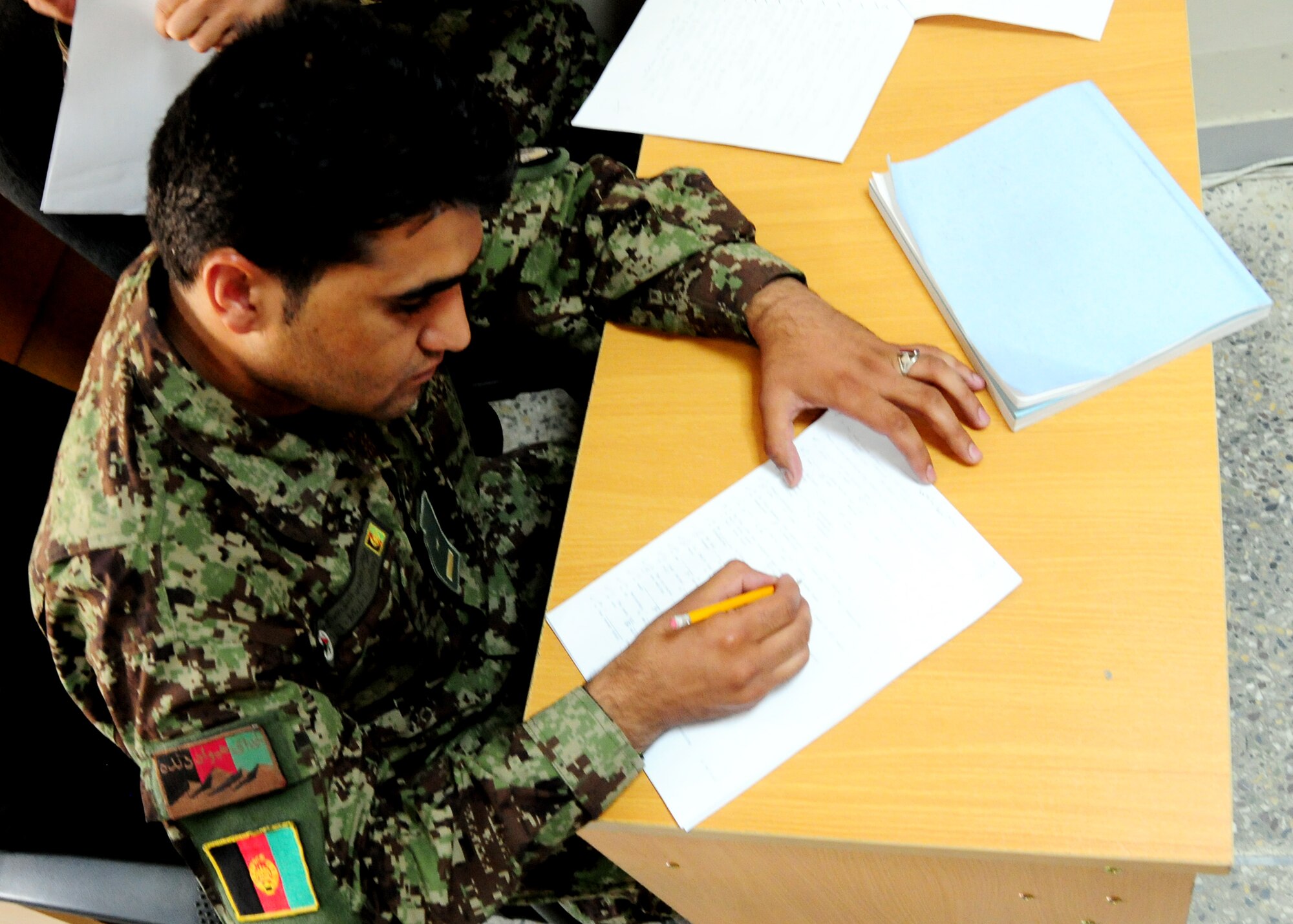 Afghan Air Force Airmen attend Kabul English Language Training Center at Kabul International Airport, Kabul, Afghanistan September 28, 2011. KELTC provides Afghan Airmen with English classes to prepare them for their specific jobs and follow-on training.  (U.S. Air Force photo by Senior Airman Amber Williams)