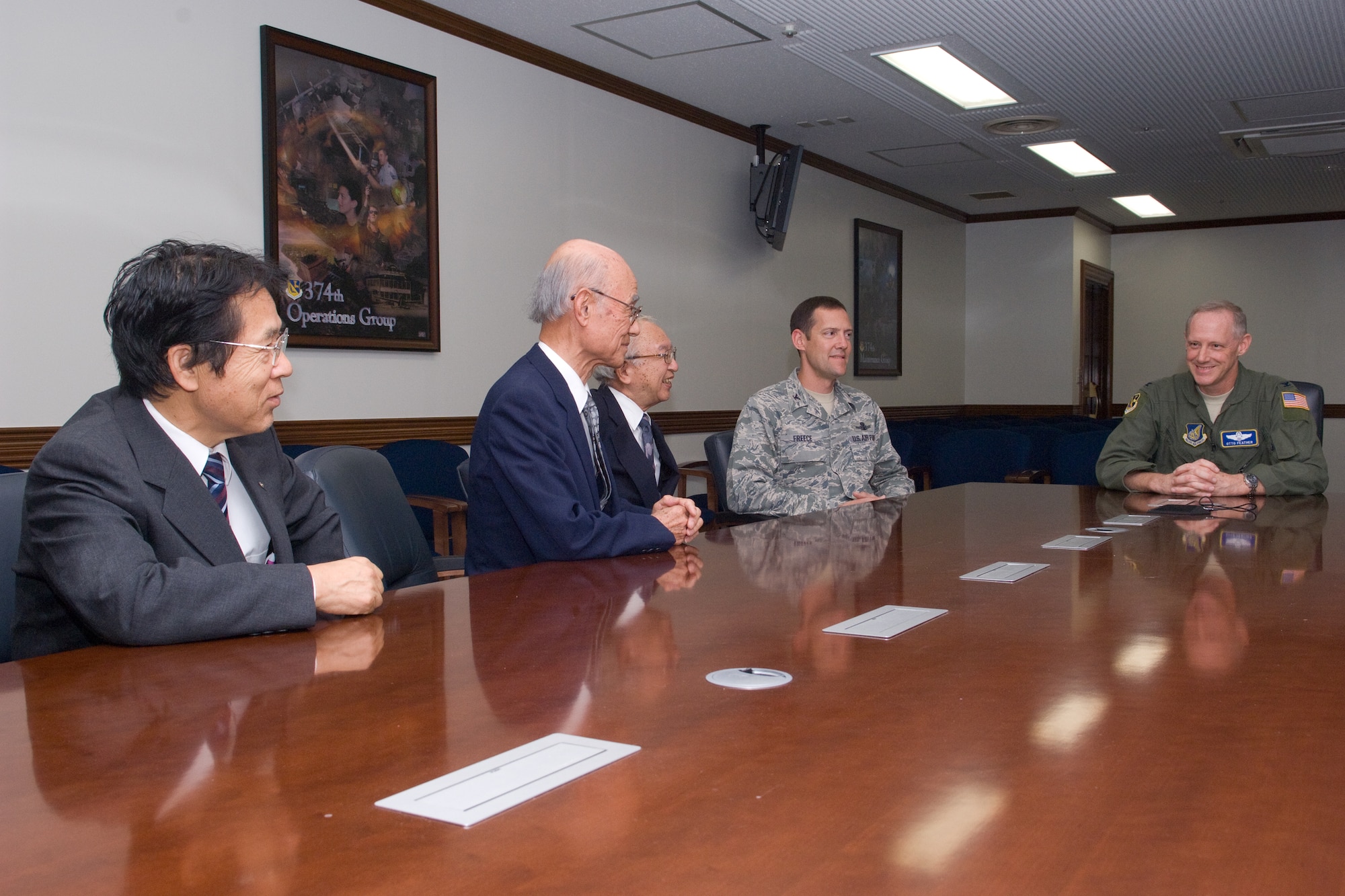 YOKOTA AIR BASE, Japan -- Members from the Fussa Yokota Goodwill Exchange club visit with Col. Otto Feather (right), 374th Airlift Wing commander, and Col. Todd Freece (left), 374th Mission Support Group commnader, at Yokota Air Base, Japan, 28 Sept. 2011. During the visit, the FYGEC presented the colonels with plaques of appreciation for Yokota's support during Operation Tomodachi. (U.S. Air Force photo/Osakabe Yasuo) 