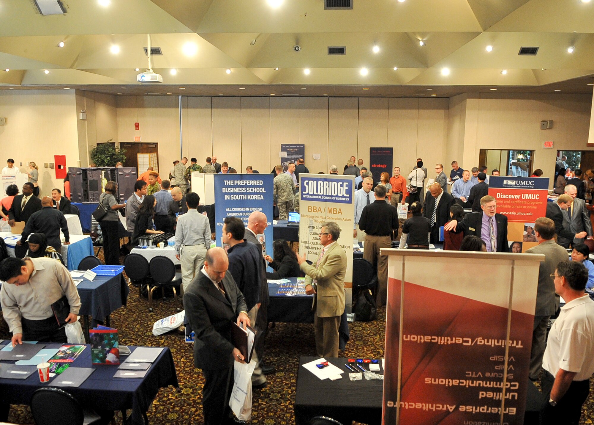 Job seekers from around the peninsula travel booth to booth being presented job opportunities from the numerous employers participating in the job fair Sept. 09, 2011. The job fair was held to support the employment endeavors of military spouses and family members. (U.S. Air Force photo/Senior Airman Adam Grant)     