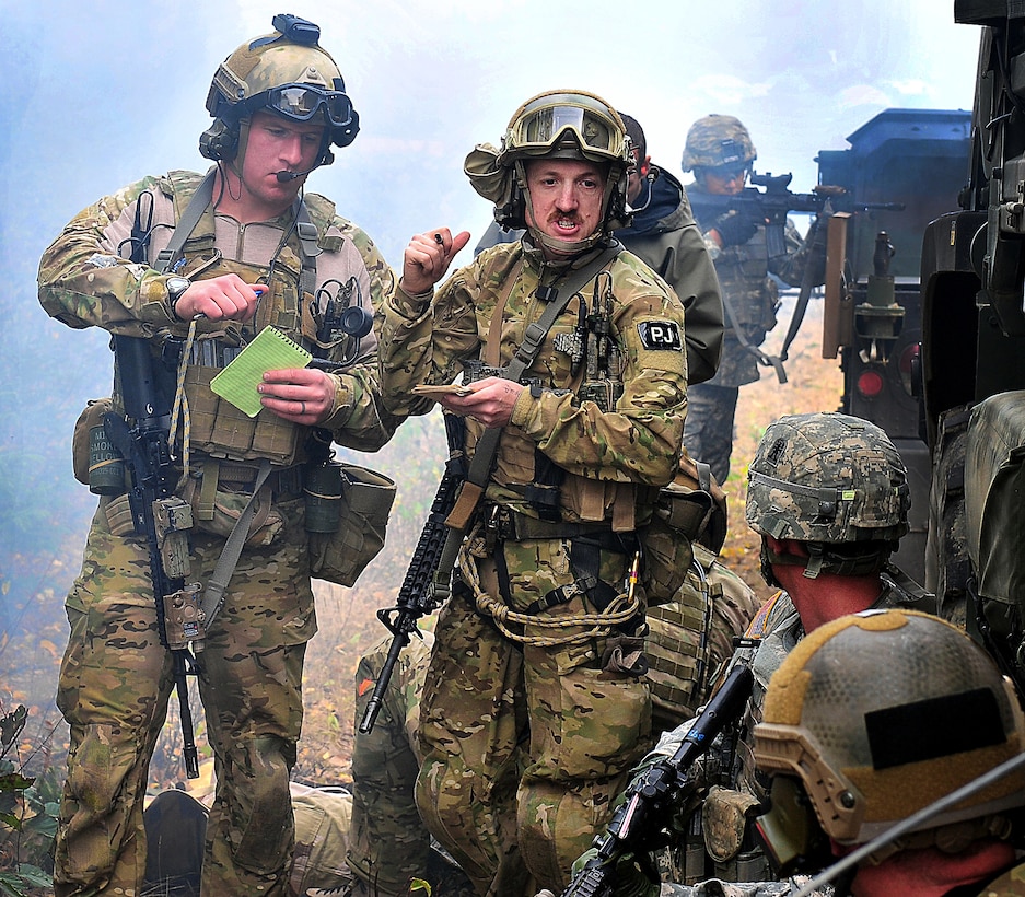 Air Force 1st Lt. Aaron Hunter, left, and Tech. Sgt. Brandon Stuemke ...