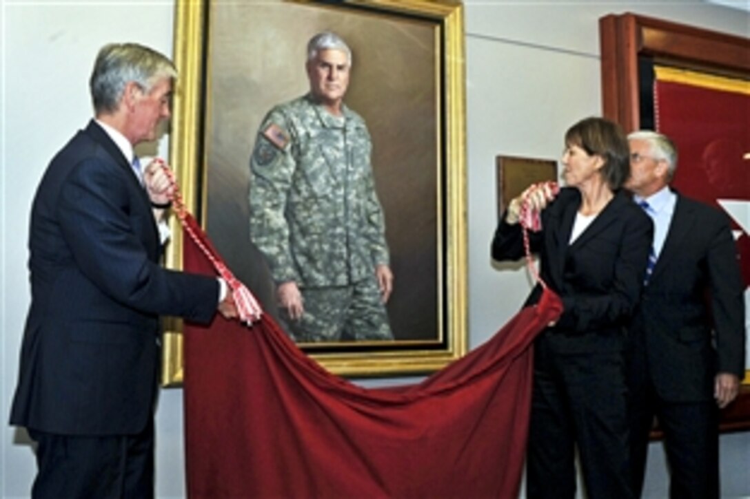 Army Secretary John M. McHugh, Sheila Casey and former Army Chief of Staff retired Gen. George W. Casey Jr.,unveil Casey's official portrait at the Pentagon, Sept. 27, 2011.