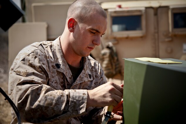 Sergeant Jared R. Hale, data networking chief, communications platoon, 3rd Battalion, 5th Marine Regiment, sets up the Support Wide Area Network version I during a field operation hosted by the 15th Marine Expeditionary Unit at Reconnaissance, Selection and Occupation of Position 95, Sept. 28. The training increased the proficiency of all the communications Marines and helped them familiarize themselves with their equipment and with each other. The 15th MEU will receive 3/5 as one of its subordinate elements for their upcoming deployment in early 2012. (U.S. Marine Corps photo by Cpl. John Robbart III)