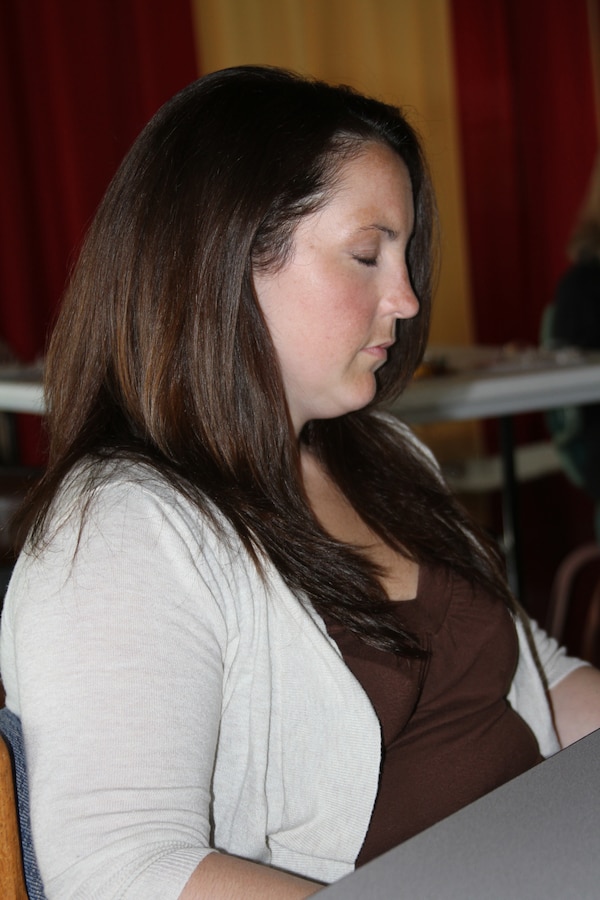 Christine M. Blake, a Coast Guard Spouse, focuses on what Linda Stark, certified clinical hypnotherapist, said while hypnotizing the stress hypnotherapy class Sept. 28 aboard Marine Corps Recruit Depot San Diego. Blake came to the class looking for serenity after having a baby recently and dealing with everyday stressors. After the class she felt a sense of relaxation she said.