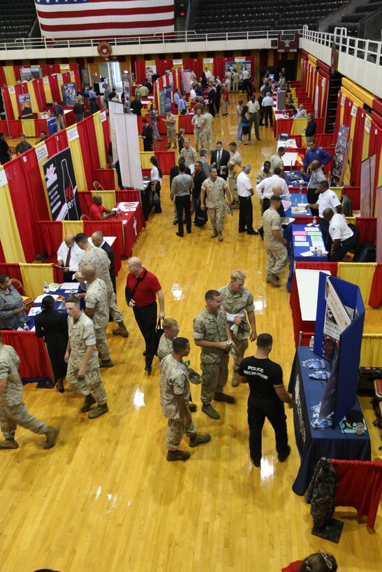 Service members, retirees, families and base employees visit booths at the Job Fair at Goettge Memorial Field House aboard Marine Corps Base Camp Lejeune, Sept.29. More than 140 employers and schools set up their booths to showcase their organizations and education courses.