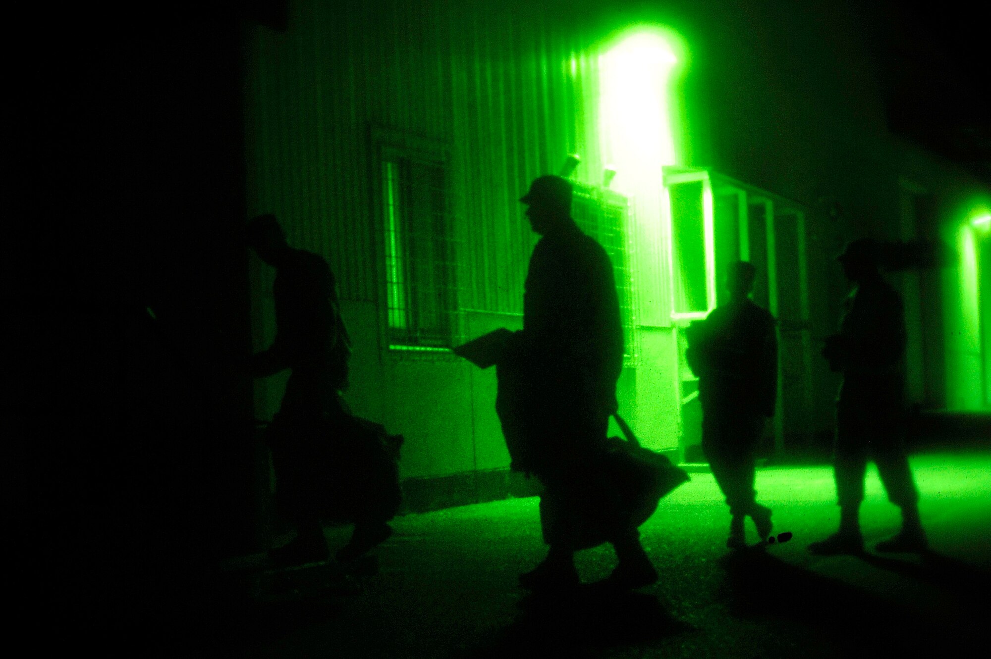 MISAWA AIR BASE, Japan - Airmen make their way to the personnel deployment function portion of an initial readiness response exercise here Sept. 30. The PDF is the final check ensuring all deploying airmen's paperwork and medical records are complete and up-to-date before leaving. (U.S. Air Force photo/Staff Sgt. Nathan Lipscomb)