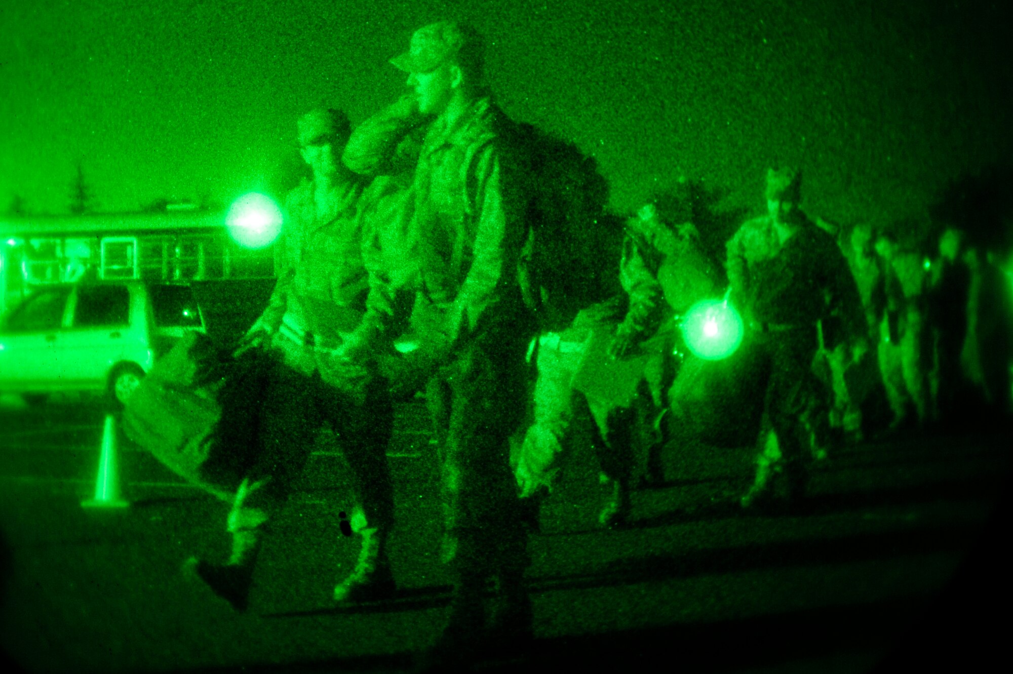 MISAWA AIR BASE, Japan - Airmen make their way to the personnel deployment function portion of an initial readiness response exercise here Sept. 30. The PDF is the final check ensuring all deploying airmen's paperwork and medical records are complete and up-to-date before leaving. (U.S. Air Force photo/Staff Sgt. Nathan Lipscomb)
