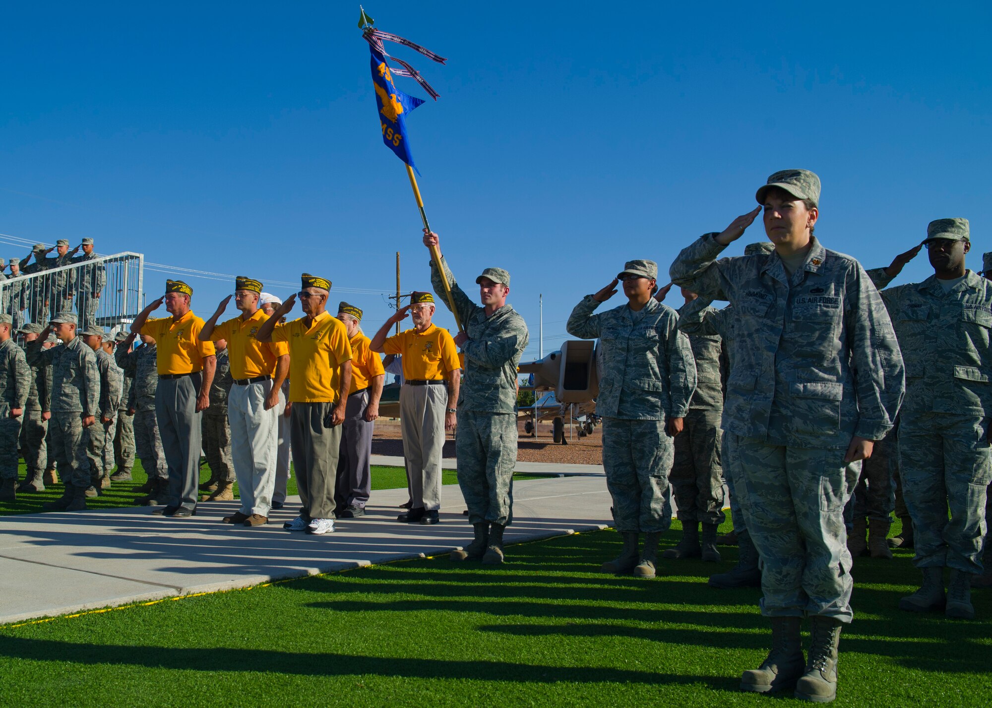 HOLLOMAN AIR FORCE BASE, N.M. -- Members of the 49th Materiel Maintenance Group and veterans render salutes during the playing of the national anthem at Heritage Park Sept. 29, 2011, as a part of this year’s Prisoners of War/ Missing in Action Recognition Day Ceremony. Observances of National POW/MIA Recognition Day are held across the country on military installations, ships at sea, state capitols, schools and veteran facilities. (U.S. Air Force photo by Senior Airman John D. Strong II/ Released)