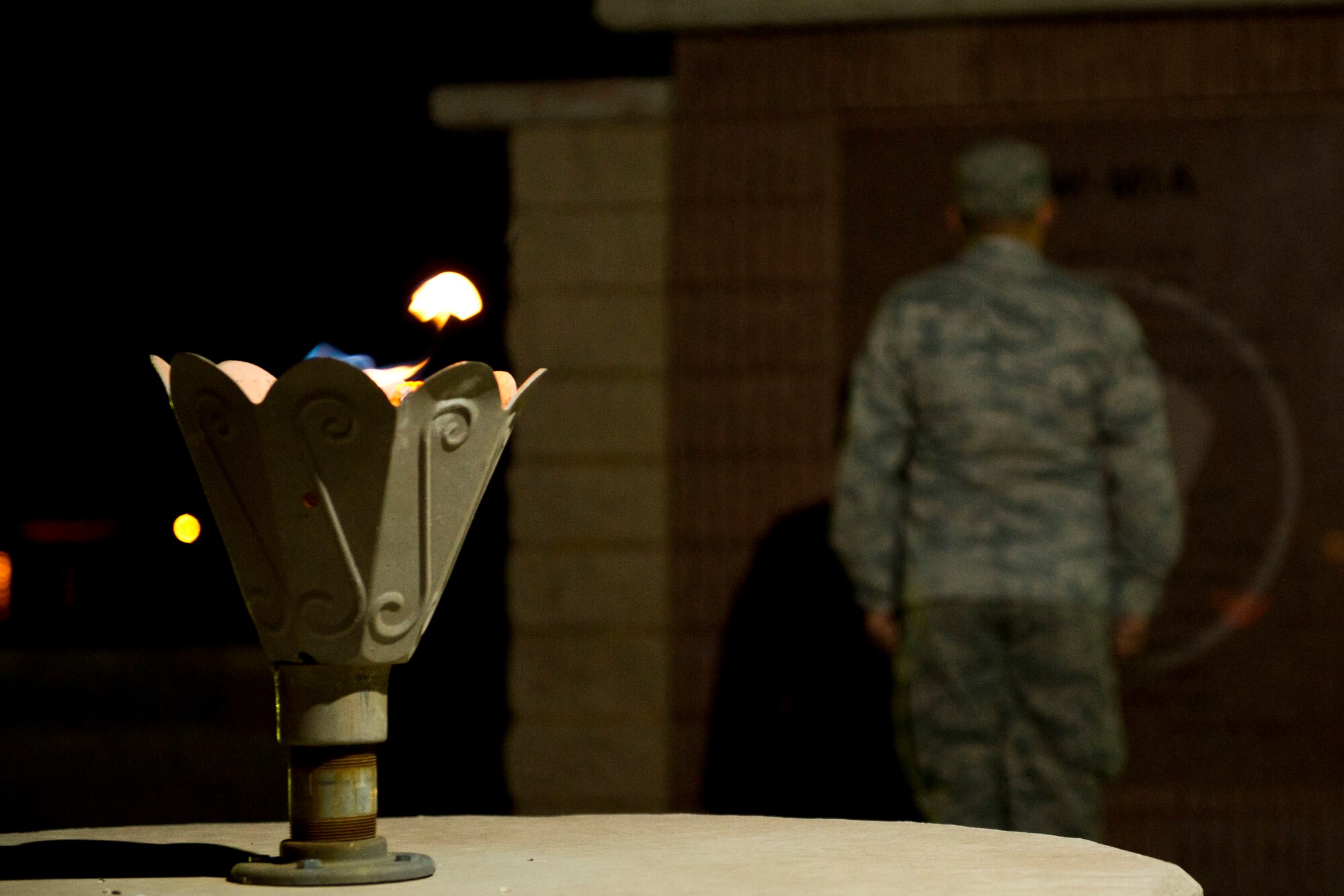 HOLLOMAN AIR FORCE BASE, N.M. -- The eternal flame remains lit as U.S. Air Force Staff Sgt. Robert Rodriguez, 49th Materiel Maintenance Group, stands at attention in front of the Prisoners of War/Missing in Action Memorial at Heritage Park Sept. 29, 2011, as part of the 2011 POW/MIA Recognition Day. For 24 straight hours, Holloman’s Basic Expeditionary Airfield Resources Base Airmen took turns standing vigil as a symbol that POWs and MIAs of today and the past are never forgotten. (U.S. Air Force photo by Airman 1st Class Joshua Turner/Released)