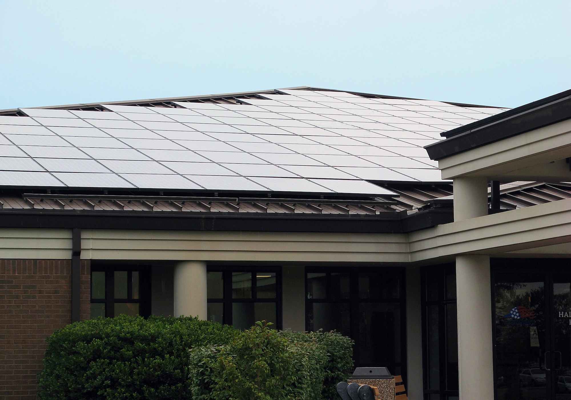 Air Mobility Command is a leader in facility energy conservation efforts and continues aggressively to meet Air Force and DoD goals through projects such as installing solar panels on facility roofs, as pictured above. (Courtesy Photo)  