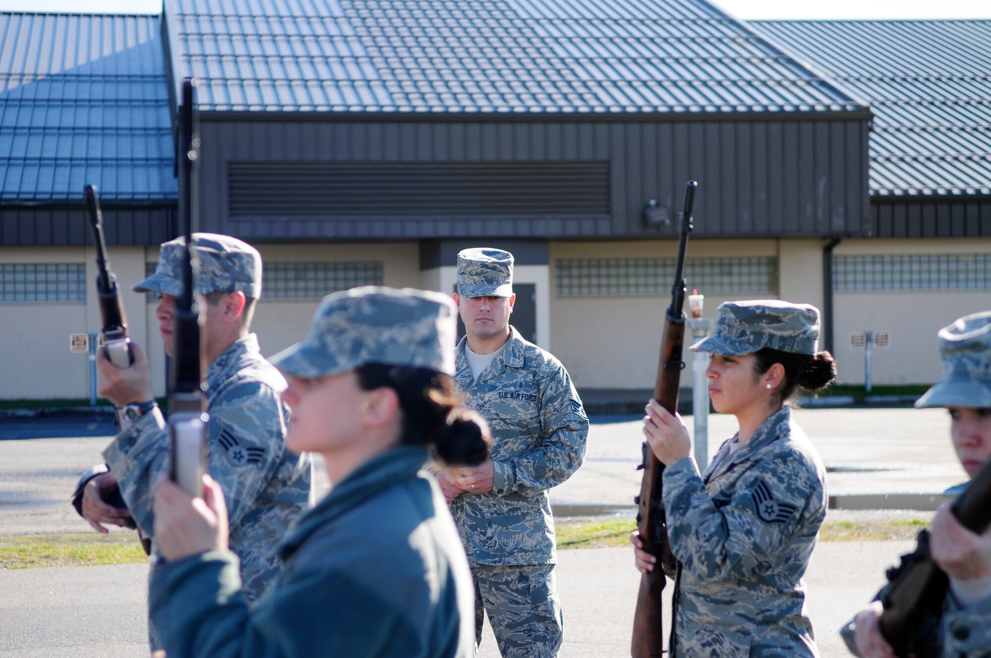 Staff Sgt. Joel Peace oversees an Honor Guard practice here Sept. 13.  Honor Guard members practice Honor Guard routines several times before executing them at an event always striving for precision and perfection.  Peace is assigned to the 354th Medical Operations squadron as a dental technician and is also an Honor Guard flight sergeant.  (U.S. Air Force photo by/Airman 1st Class Yash Rojas)