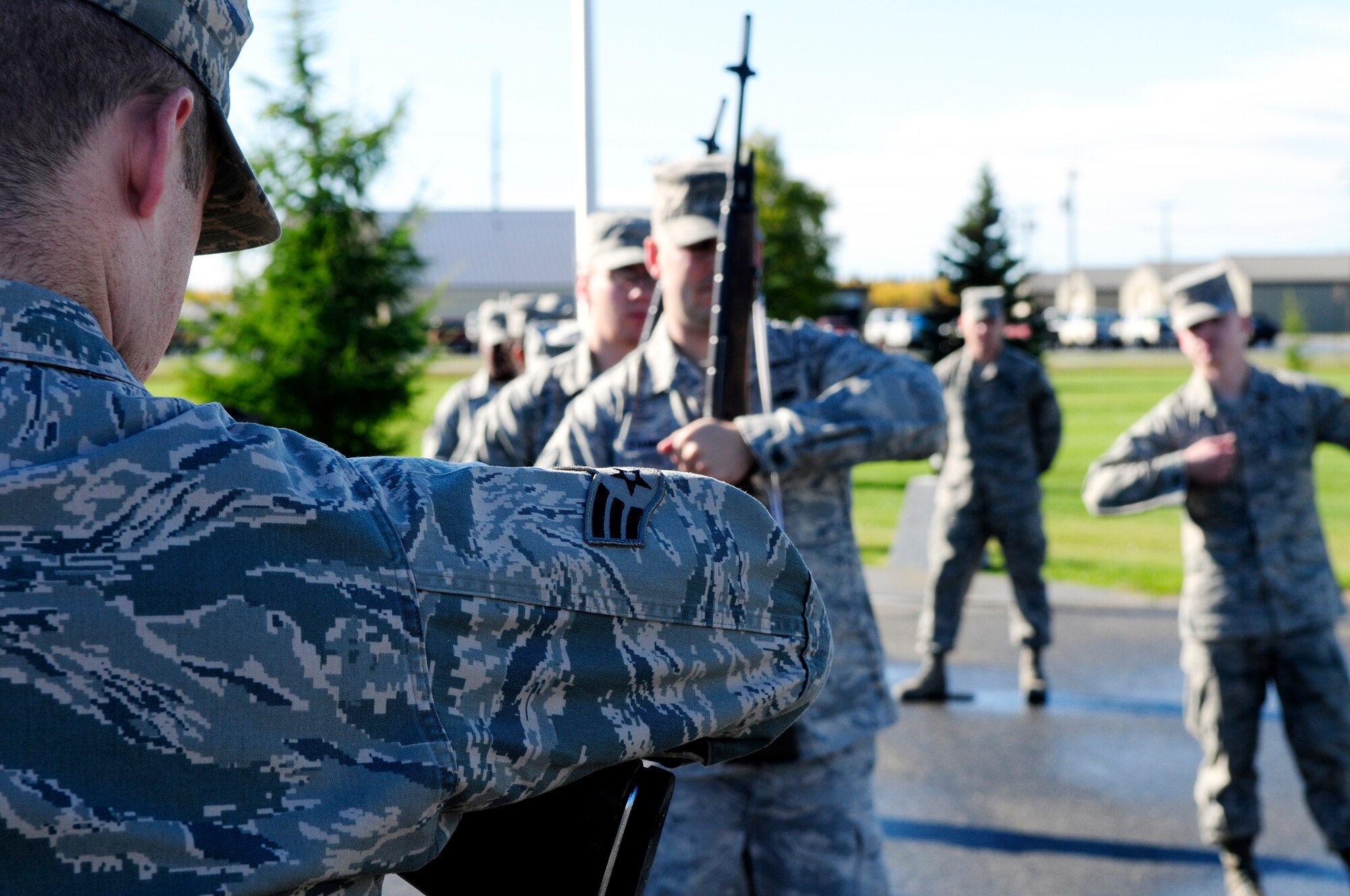 An Airman instructs Honor Guardsmen here Sept. 13.  The base Honor Guard practices each week for several hours to perfect technique and execution of all movements.  (U.S. Air Force photo by/Airman 1st Class Yash Rojas)