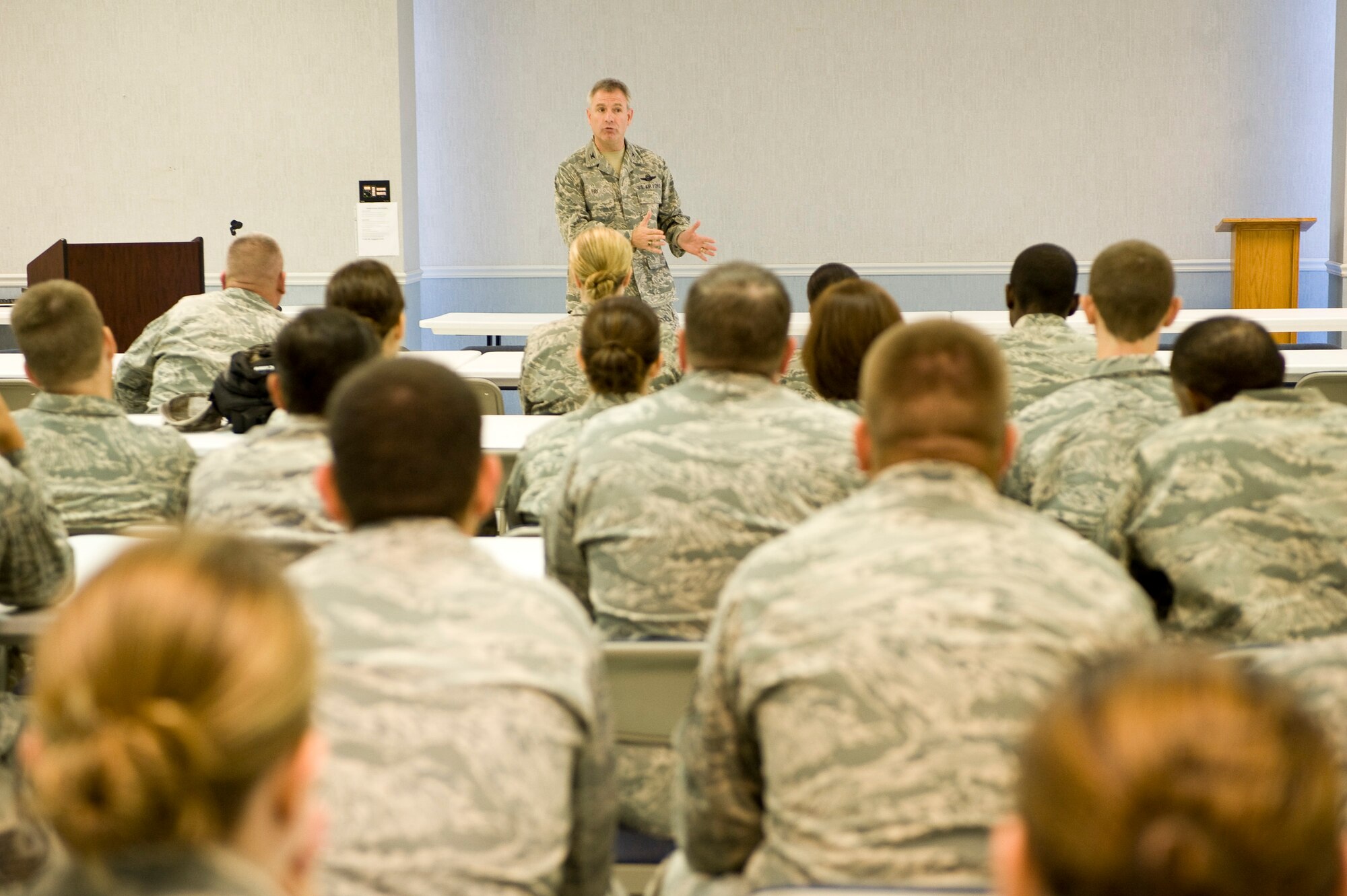 Col. Tim Fay, 2nd Bomb Wing commander, briefs Airmen during a Wingman Intervention Day event at the Chapel 2 annex on Barksdale Air Force Base, La., Sept. 27. The event taught participants skills needed to help fellow Airmen, such as how to effectively engage a coworker who may be having problems, and guide them to the resources that can help resolve the issue. (U.S. Air Force photo/Senior Airman Chad Warren)(RELEASED)