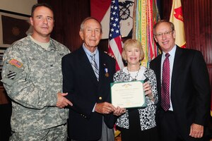 Col. Thomas R. Wetherington (left), 733rd Mission Support Group and Army Support Activity commander, presents retired Lt. Col. Harold Campbell (second from left) the Soldier’s Medal and certificate, with his wife Annie and son, Steve, during an award ceremony at Fort Eustis Sept. 26, 2011. The medal is awarded to any servicemember who served with the Army and distinguished themselves by heroism not involving actual conflict with an enemy. (U.S. Air Force photo by Staff Sgt. Ashley Hawkins/Released)