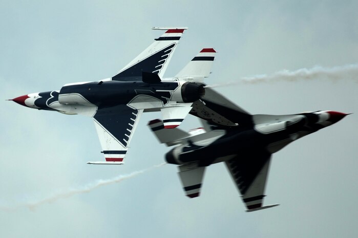 Majs. Aaron Jelinek, Thunderbird 5, Lead Solo and J.R. Williams, Thunderbird 6, Opposing Solo, perform the Inverted Opposing Knife Edge Pass during the Boston Portsmouth Air Show at Pease Air National Guard Base, N.H., Aug. 14, 2011.
(U.S. Air Force photo/Staff Sgt. Larry E. Reid Jr., Released)