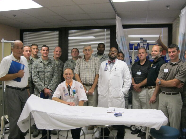 Airmen from Seymour Johnson Air Force Base join the medical review board, case workers and patient John Pendergrass for a group photo at the Durham Veterans Affairs Medical Center in Durham, N.C., Sept. 22, 2011.   Mr. Don Johnstone, left, Military Affairs Committee member, veteran and Goldsboro native, joined Airmen from Seymour Johnson to visit with veterans at the DVAMC.  Pendergrass lost his leg during combat and was just approved for a new leg prosthetic.  (U.S. Air Force photo by Staff Sgt. Mary Holycross)