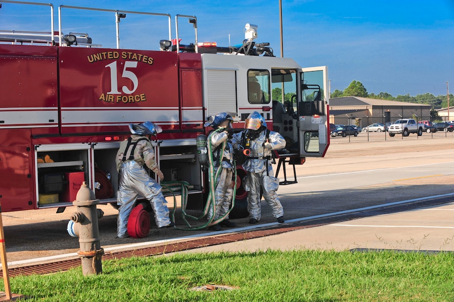 Firefighters from the 23rd Civil Engineer Squadron respond to a building fire during a phase II operational readiness exercise at Moody Air Force Base, Ga., Sept. 29, 2011. The scenario evaluated the evacuation and accountability procedures of the building and tested the firefighter’s response to the fire. (U.S. Air Force photo by Senior Airman Stephanie Mancha/Released)