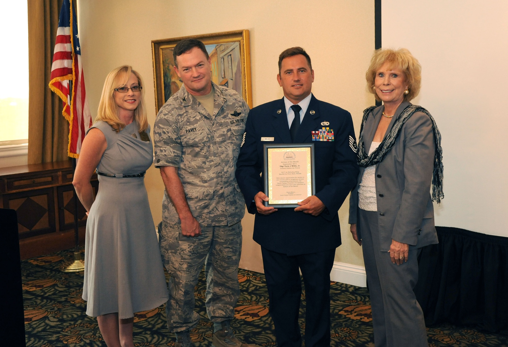 Tampa, Fla. -- One of the 927th Air Refueling Wing's own was recognized by the South Tampa Chamber of Commerce during a ceremony recently.  Technical Sgt. Terry Willis is a Aircraft Metals Technologist and supervises the fabrication support for 52 tenant units at MacDill Air Force Base.  He is flanked by Teresa Foss, chairperson of the South Tampa Chamber of Commerce Military Affairs Committee, Col. Dave Pavey, commander of the 927th ARW, and Paddy Moses, Chairman of the Board at Memorial Hospital. (Official U.S. Air Force photo by Staff Sgt. Shawn Rhodes) 