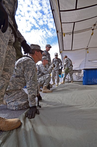 141st Air National Guard members set up a tent during the Homeland Response Force (HRF) evaluation from Aug. 8-12 in Spokane. (U.S. Air Force photo/Staff Sgt. Anthony Ennamorato)