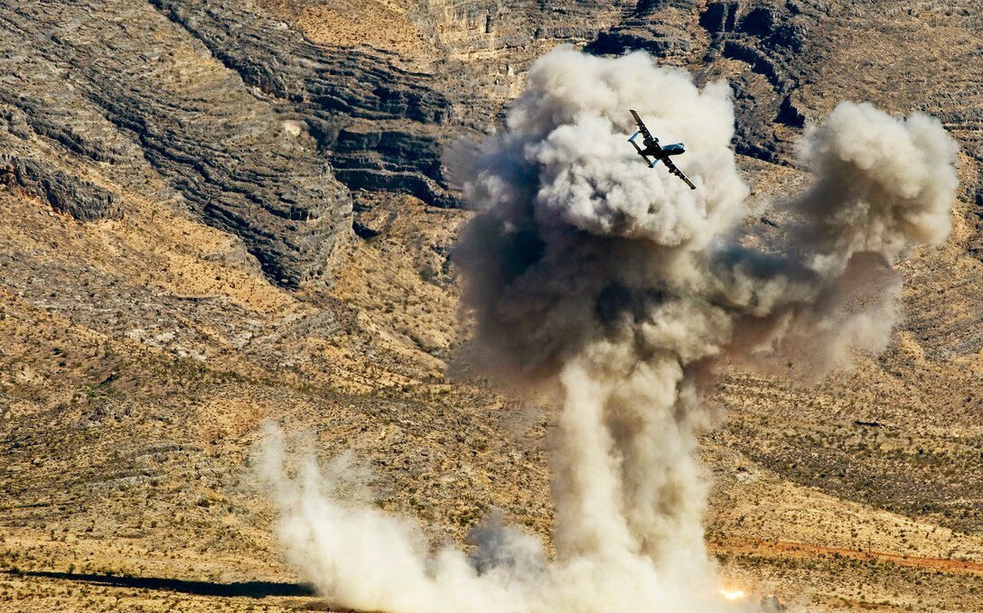 An A-10 Thunderbolt II from the U.S. Air Force Weapons School at Nellis Air Force Base, Nev., drops a AGM-65 Maverick during a close-air support training mission Sept. 23, 2011, over the Nevada Test and Training Range.  U.S. Air Force Weapons School students participate in many combat training missions over the NTTR during the six-month, graduate-level instructor course. (U.S. Air Force photo/Senior Airman Brett Clashman) 