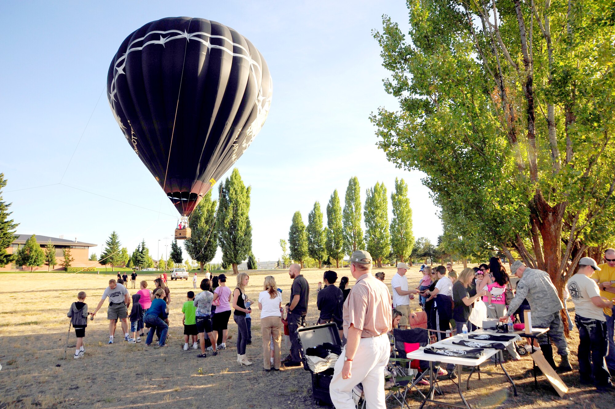 The Survival Evasion Resistance Escape school hosted the balloon team as part of a fundraiser. They provided balloon rides to families here with proceeds being donated to the Wounded Warrior Project. The WWP’s goal is to raise awareness and gain public assistance for the needs of injured service members. (U.S. Air Force photos/Airman 1st Class Taylor Curry)