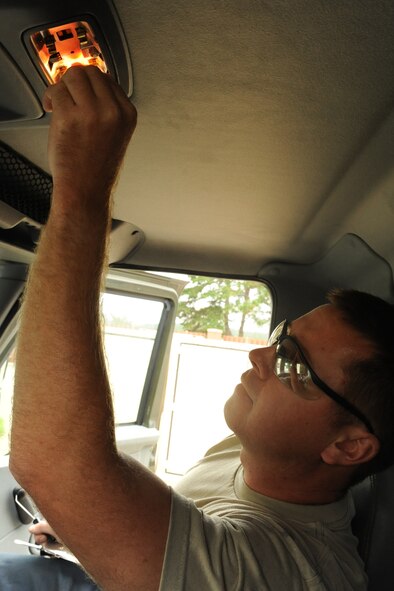 Staff Sgt. Travis Cecil inserts a light bulb inside a refueling truck at Seymour Johnson Air Force Base, N.C., Sept. 27, 2011. The 4th Logistics Readiness Squadron (LRS) vehicle management flight encourages squadrons to alert them to even the smallest problems on government vehicles. Cecil is a 4 LRS refueling maintenance technician and a native of New Haven, Ky. (U.S. Air Force photo by Senior Airman Whitney Stanfield)  