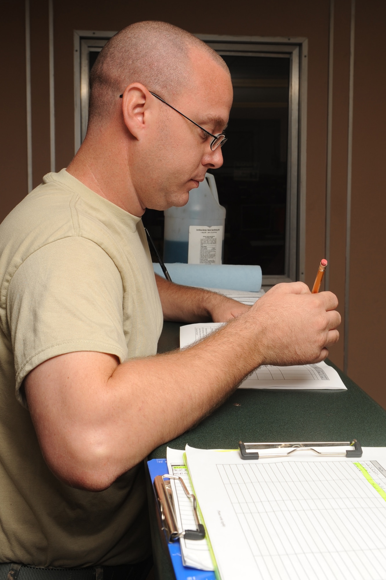 Staff Sgt. Andrew Hawley reviews an Air Force Occupational Safety and Health standards checklist before performing an inspection on Seymour Johnson Air Force Base, N.C., Sept. 27, 2011. Hawley inspects anything that could be a safety hazard such as broken material, chemical storage, exit signs and personal protective equipment in the vehicle management flight. Hawley is a 4th Logistics Readiness Squadron customer service representative and a native of Burlington, Kan. (U.S. Air Force photo by Senior Airman Whitney Stanfield)