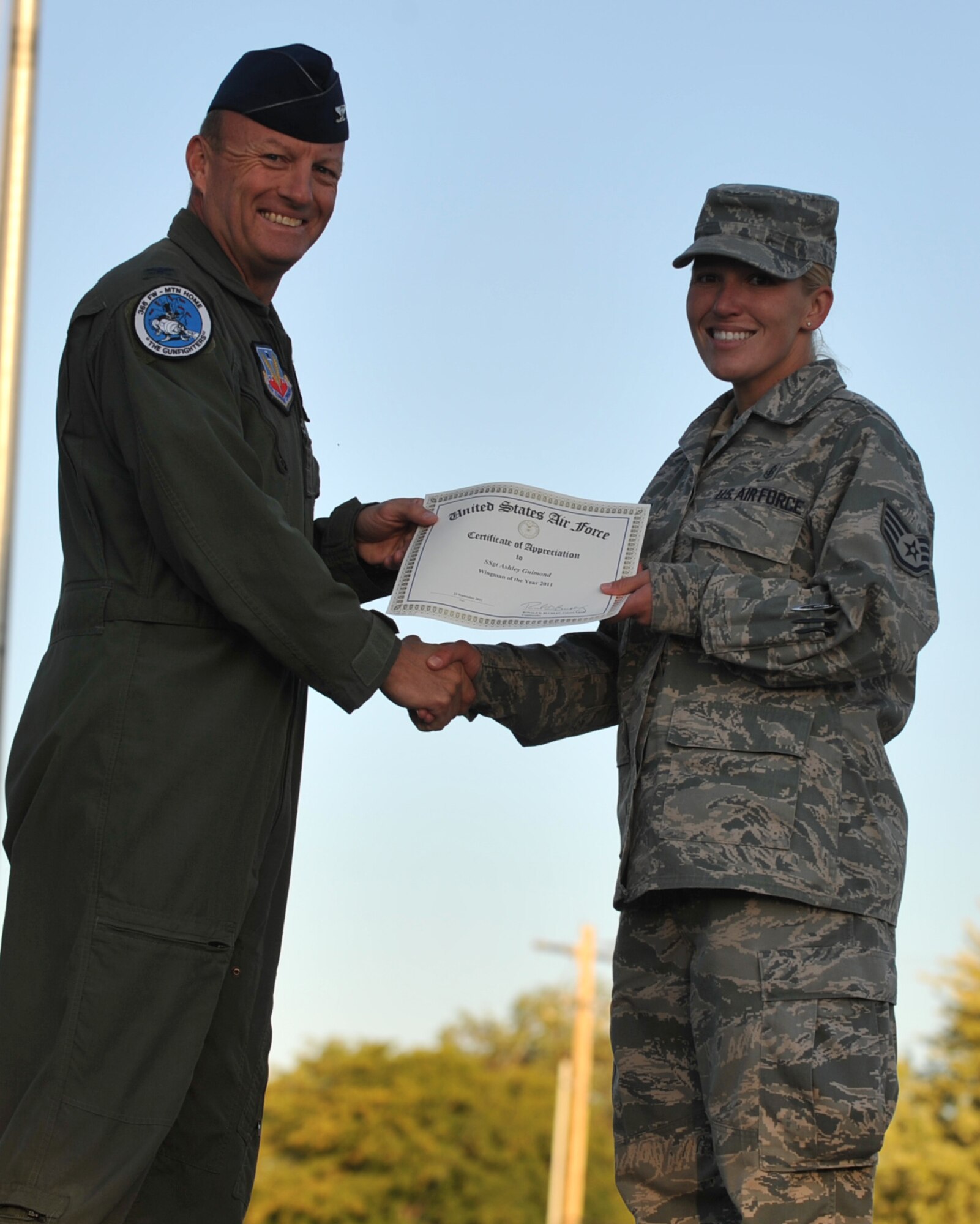 Staff Sgt. Ashley Guimond, 366th Medical Support Squadron, receives a wingman of the year award Sept. 23, 2011 at Mountain Home Air Force Base, Idaho. Guimond received the award for helping watch the children of single parents so they could have a much needed break.  (U.S. Air Force photo by Airman 1st Class Heather Hayward)