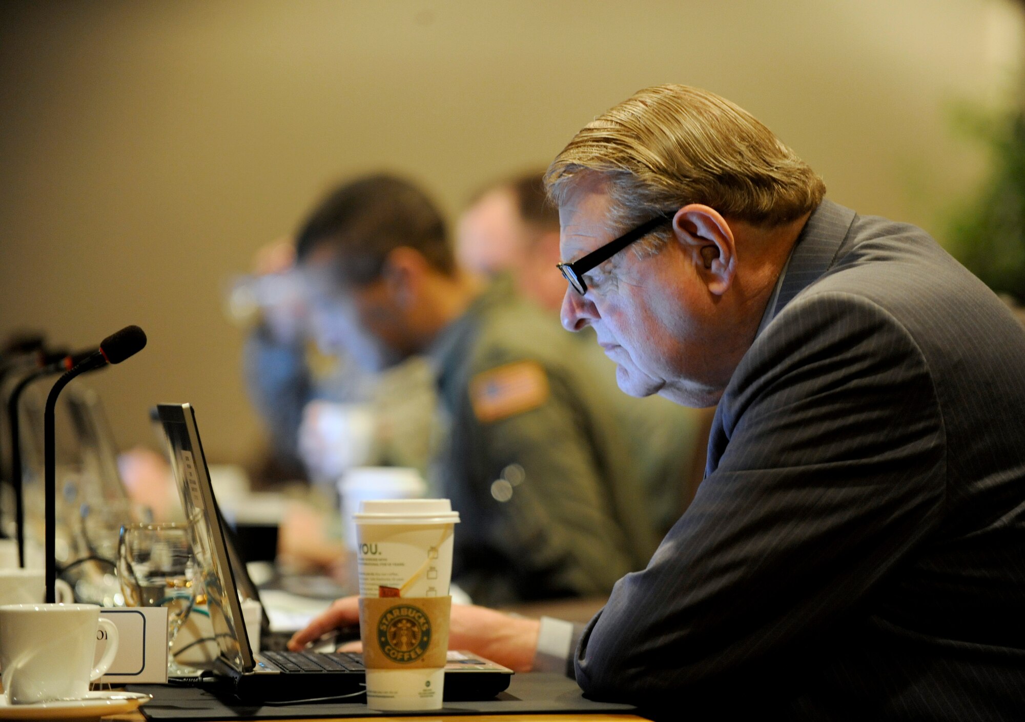 William Davidson, the administrative assistant to the secretary of the Air Force, works on his laptop during the 2011 CORONA TOP.  Davidson will retire Sept. 30 after 43 years of Air Force service.  He has participated in 39 CORONAs during his career. (Courtesy photo)