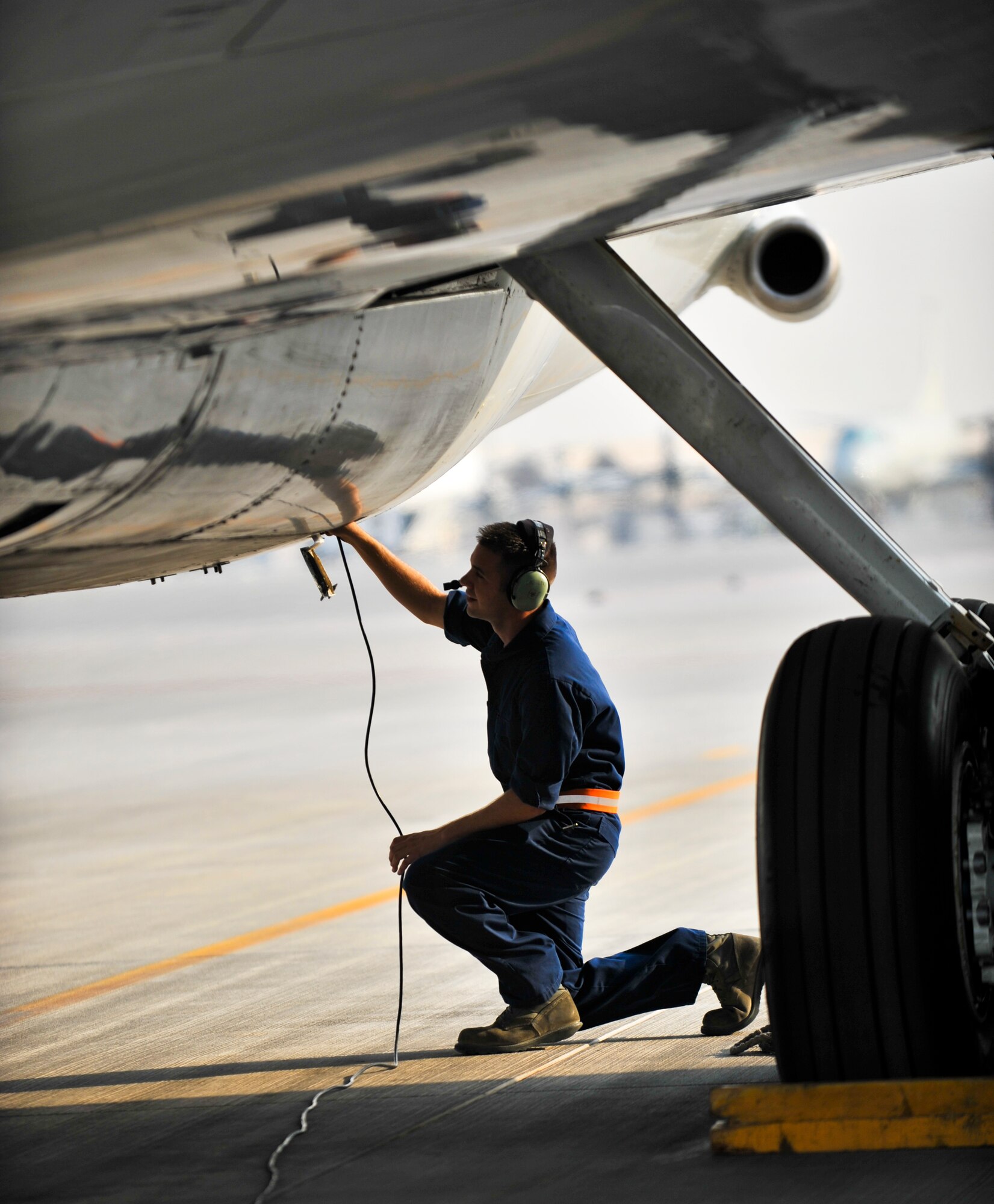 Senior Airman Joshua Beacom, 7th Expeditionary Aircraft Maintenance Unit crew chief, conducts a post flight check on an E-8C Joint Surveillance Target Attack Radar System, or Joint STARS, aircraft, Sept. 25, 2011, at an undisclosed location in Southwest Asia.  Beacom, a native of Jacksonville, Fla., is deployed from Robins Air Force Base, Ga. (U.S. Air Force photo/Senior Airman Paul Labbe)
