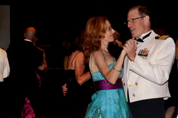 Capt. Steve Brasington and his wife dance the night away during the Joint Base Charleston Military Ball Sept. 24, 2011. The evening consisted of the posting of the Colors by an honor guard made up of all services, dinner, dancing and a presentation from guest speaker Coach Darrin Horn, University of South Carolina Gamecock's head basketball coach. More than 800 service members from across the joint base, encompassing Army, Navy, Air Force and Marine Corps, attended the military ball. Brasington is the Executive Officer of Naval Health Clinic Charleston. (U.S. Air Force photo/2nd Lt. Susan Carlson)
