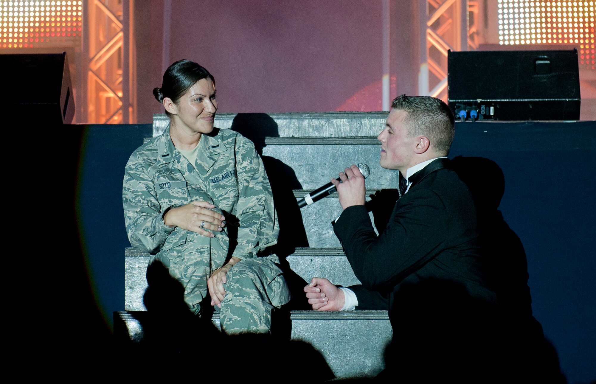 1st Lt. Robert Doyle, Tops in Blue officer in charge, sings to 1st Lt. Jessica Soto, 817th Expeditionary Airlift Squadron intelligence officer in charge, during a performance Sept. 27, 2011, at Incirlik Air Base, Turkey. Tops in Blue is comprised of 35 to 40 vocalists, musicians, dancers and technicians whose primary purpose is to perform for Airmen and their families around the world. (U.S. Air Force photo by Senior Airman Anthony Sanchelli/Released)