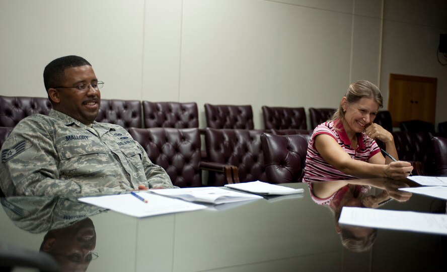 Staff Sgt. William Mallory, 39th Communications Squadron, and Tina Olson laugh during a Lunch and Learn Sept. 29, 2011, at Incirlik Air Base, Turkey. The Lunch and Learn was hosted by the Airman and Family Readiness Center and provided attendees tips on how to stay positive in negative situations. (U.S. Air Force photo by Senior Airman Clayton Lenhardt/Released)