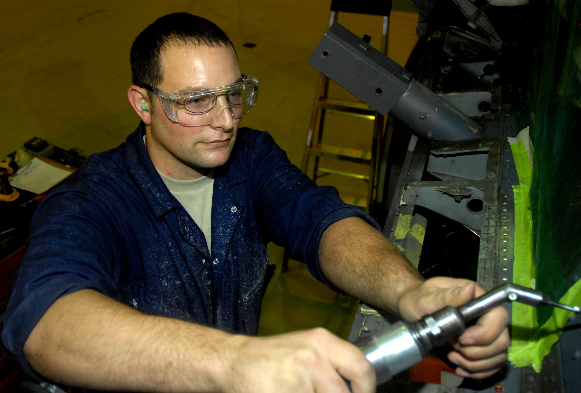 ROYAL AIR FORCE LAKENHEATH, England - Tech. Sgt. John Dunn, 48th Equipment Maintenance Squadron aircraft structural maintenance production supervisor, repairs an HH-60G Pave Hawk helicopter, Sept. 21, 2011. Dunn was nominated for a Liberty Spotlight because he displays the core value of "Excellence in All We Do". (U.S. Air Force photo by Airman Cory Payne) 