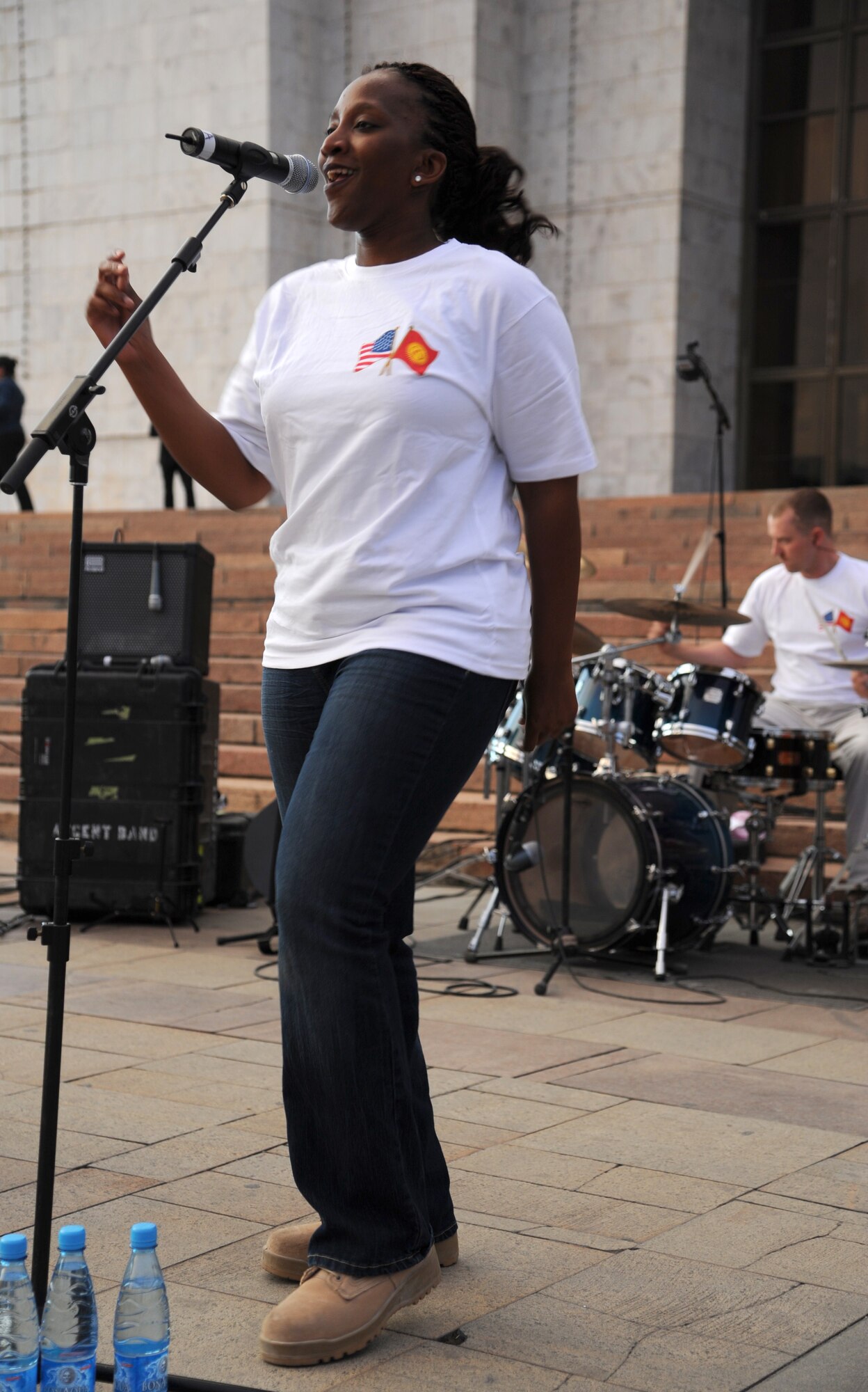 Staff Sgt. Amber Grimes sings during a “Top Cover” performance at A’la Too Square in Bishkek, Kyrgyzstan, Sept. 23. The U.S. Air Forces Central Command Band Top Cover visited the country to build troop morale and public diplomacy. Grimes is a vocalist deployed from Joint Base Elmendorf-Richardson, Alaska. (U.S. Air Force photo/Tech. Sgt. Hank Hoegen)
