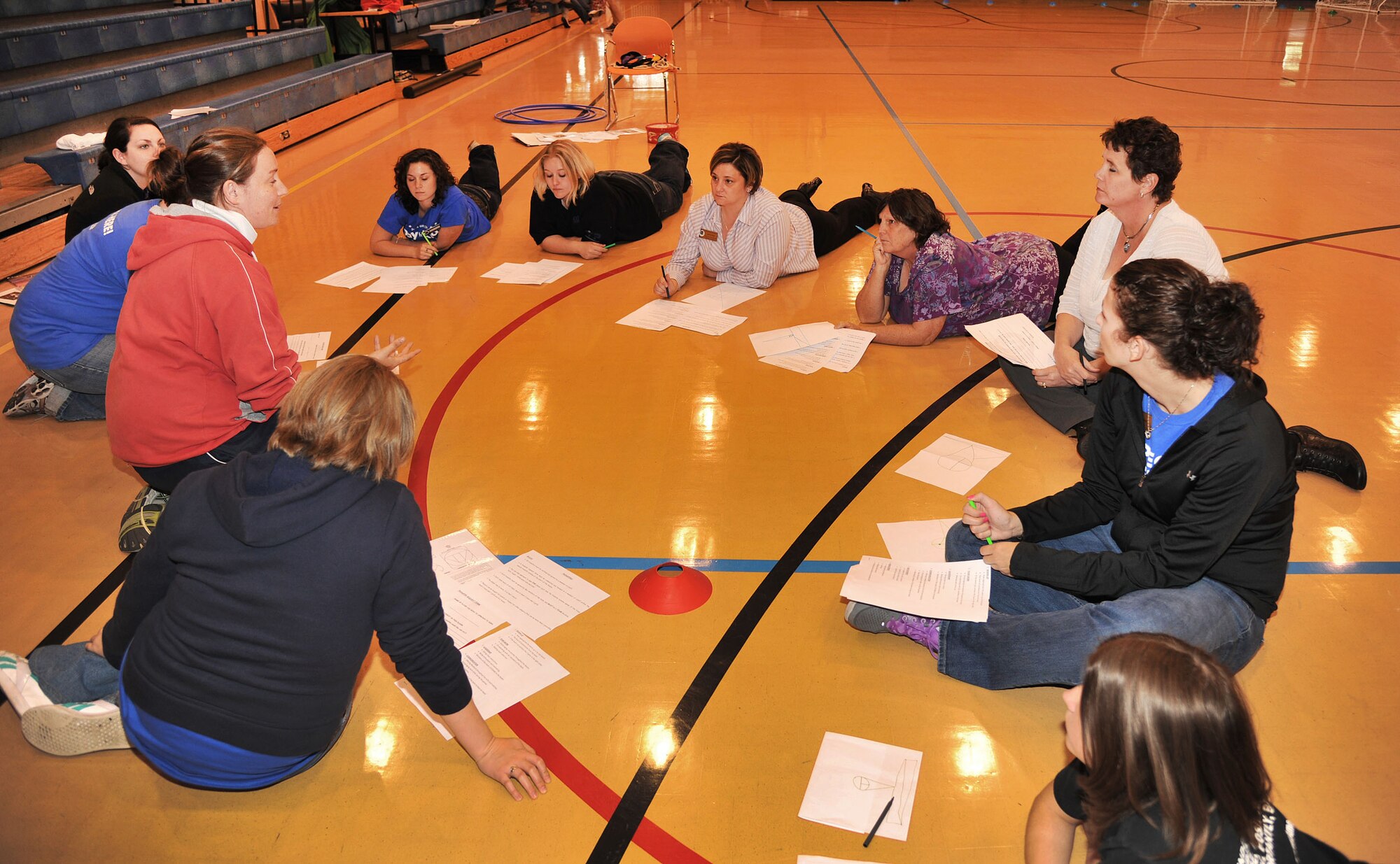 RAF MILDENHALL, England - Youth center staff members from RAFs Mildenhall, Lakenheath and Croughton brainstorm new team building activity ideas during a three-day training camp with the King’s Foundation here Sept. 22, 2011. The training camp was designed to introduce the staff to new and unique ways of interacting with children. (U.S. Air Force photo by Senior Airman Jerilyn Quintanilla)