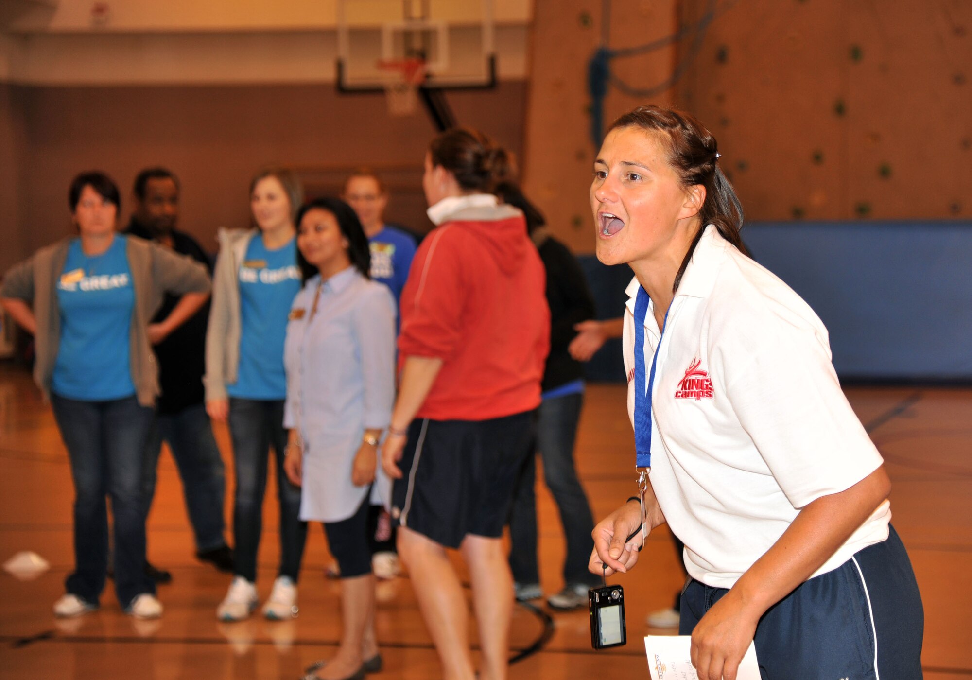 RAF MILDENHALL, England - Heather Latter, King’s Foundation, leads a team building exercise as part of a three-day training camp with youth center staff members here Sept. 22, 2011. King’s Foundation is a charity group based throughout the United Kingdom and offers special sports and activity camps to children. (U.S. Air Force photo by Senior Airman Jerilyn Quintanilla)