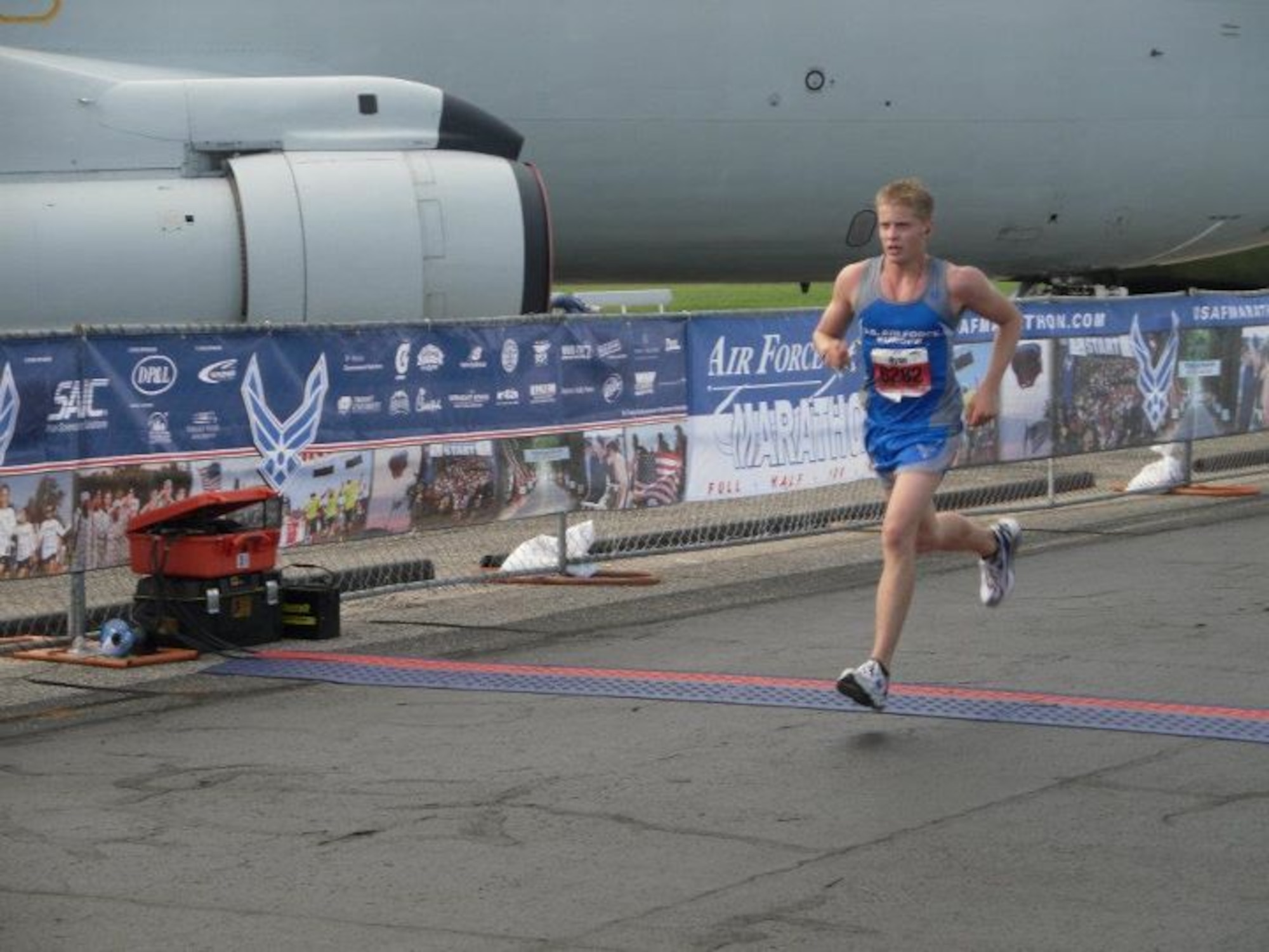 WRIGHT- PATTERSON AIR FORCE BASE, Ohio -- Airman 1st Class Ryan Jelstrom, U.S. Air Forces in Europe running team member, crosses the finish line at the U.S. Air Force Marathon’s half marathon Sept. 17 at Wright – Patterson Air Force Base, Ohio with a time of 01:28:00. Jelstrom is a flight equipment maintainer with the 480th Fighter Squadron in Spangdahlem AB, Germany. He was recruited for the team after placing 3rd in the USAFE half marathon at Spangdahlem AB .  (U. S. Air Force courtesy photo)