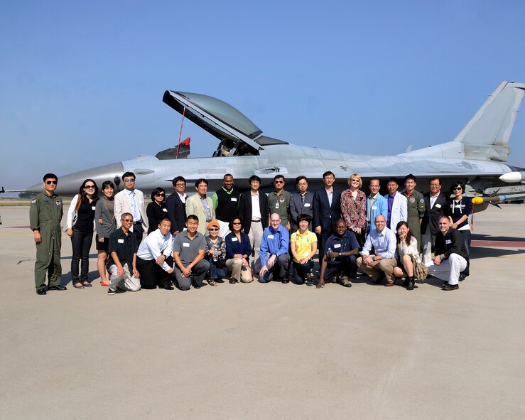 KUNSAN AIR BASE, Republic of Korea -- Members of the 8th Medical Group pose along with members of the Wonkwang University Medical Center and Gunsan Medical Center executive leadership teams for a goup photo here Sept 24. Wonkwang University and Gunsan Medical Center’s leadership teams were invited by the 8th Medical Group commander and leadership to tour the base. The Wonkwang University and Gunsan Medical Centers are Kunsan AB’s referral hospitals of choice nearby who provide specialty care to Wolf Pack members when it is not available at the 8th MDG clinic. (U.S. Air Force photo illustration/Staff Sgt. Rasheen A. Douglas)