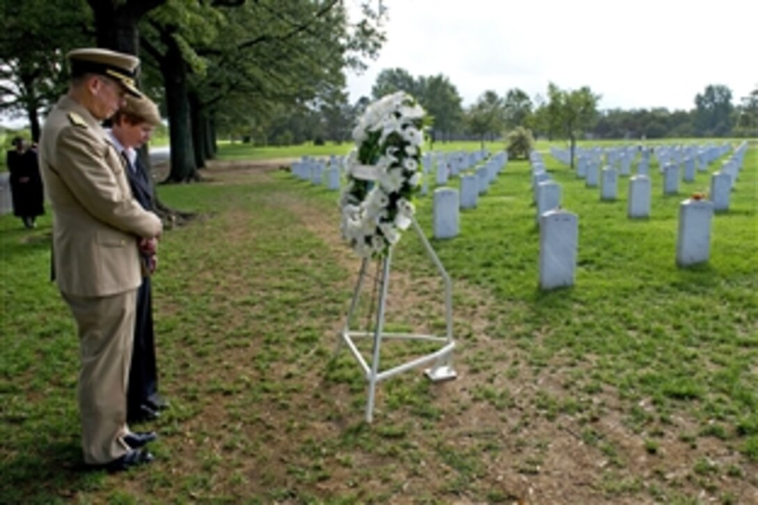 In his final full day as the 17th chairman of the Joint Chiefs of Staff, Navy Adm. Mike Mullen and his wife, Deborah, lay a memorial wreath at Arlington National Cemetery's Section 60, Sept. 29, 2011. Mullen will retire after serving more than 40 years in uniform, handing the reins to Army Gen. Martin E. Dempsey during a ceremony on Fort Meyer, Va.